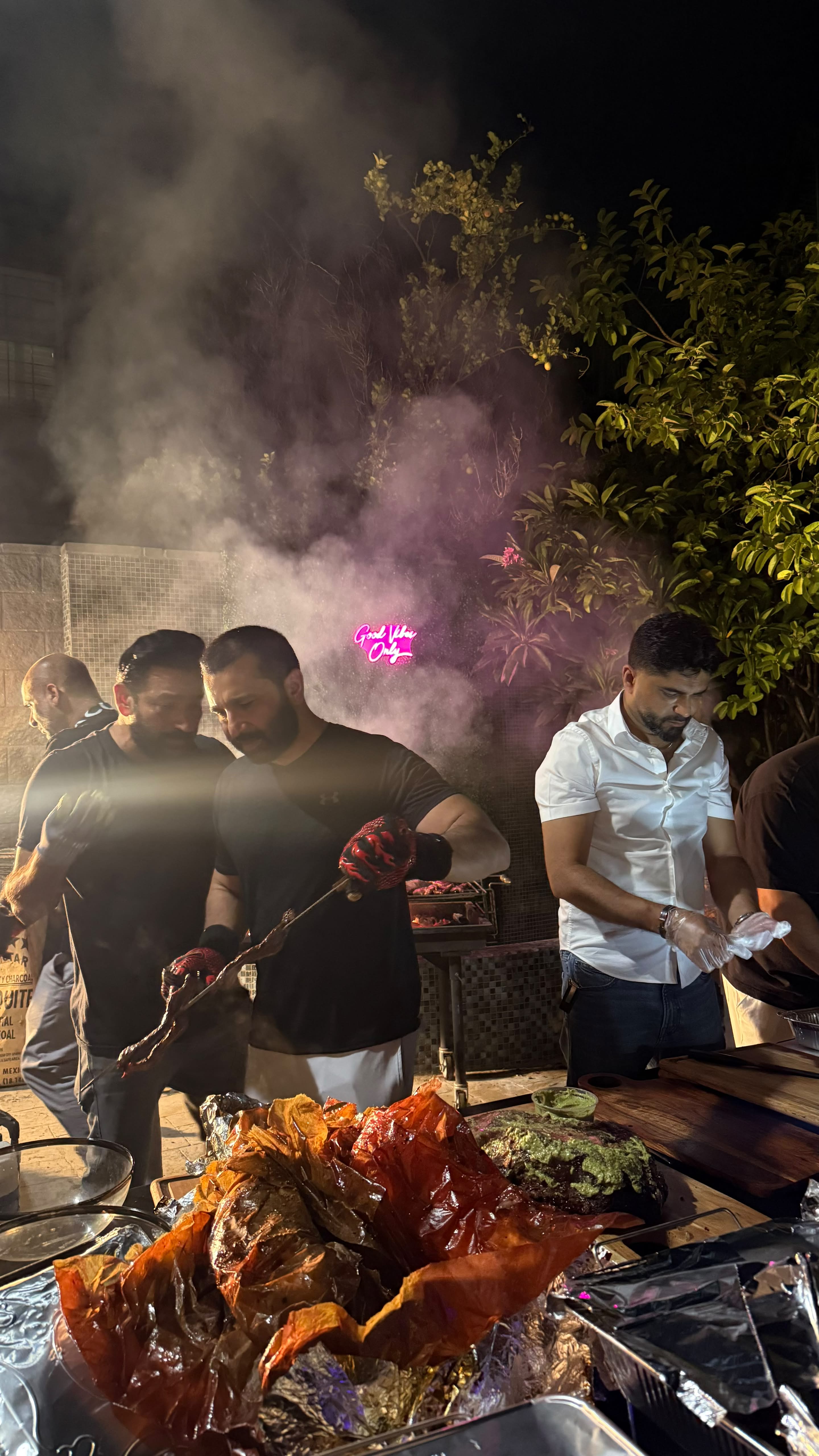 Imran and crew working the fire station at a live event, smoke rising